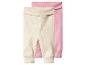 Zwei gerippte Baby-Leggings, eine beige und eine rosa.