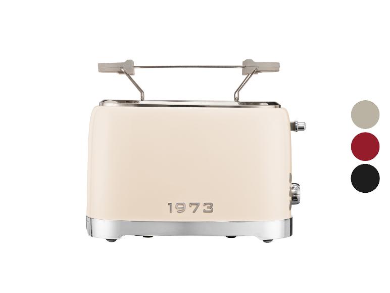 Cremefarbener Toaster mit Metalldetails und der Aufschrift „1973“.
