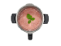 Rosa Smoothie mit frischer Minze in einem Edelstahlmixer.
