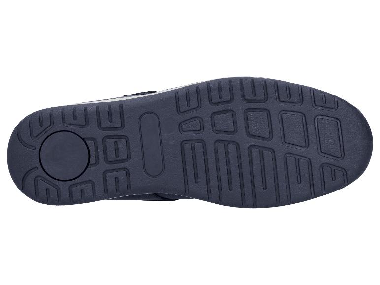 Dunkle Schuhsohle mit geometrischem Profil auf weißem Hintergrund.