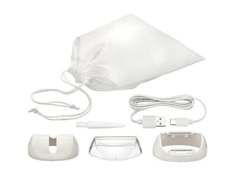 Epiliererset mit weißem Beutel, USB-Kabel, Bürste und Aufsätzen.