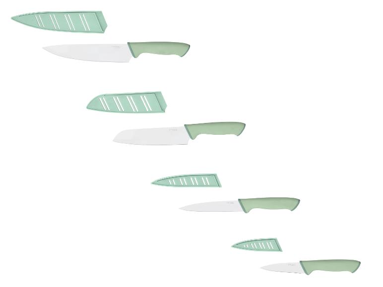 Grüne Küchenmesser mit weißen Klingen und passenden Schutzhüllen.