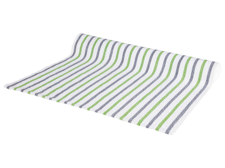 Ein weißes Tischtuch mit grünen und grauen Streifen.