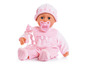 Eine rosa Baby-Puppe mit einem Schnuller, einer Flasche und einer Mütze.