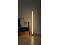 LED-Stehlampe mit Blasen neben einem Sessel mit Decke und Buch.