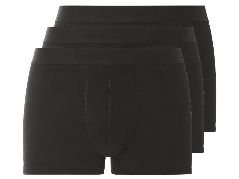 Drei schwarze Boxershorts.