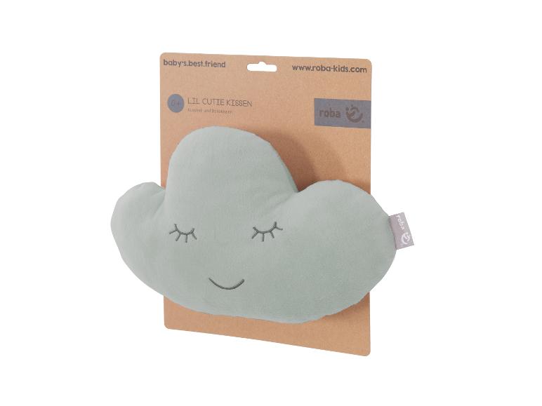 Hellgrünes wolkenförmiges Kissen mit schlafendem Gesicht auf brauner Kartonverpackung von Roba.