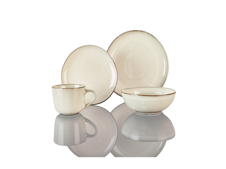 Eine Tasse, ein tiefer Teller und ein flacher Teller aus weißem Keramik mit braunem Rand.