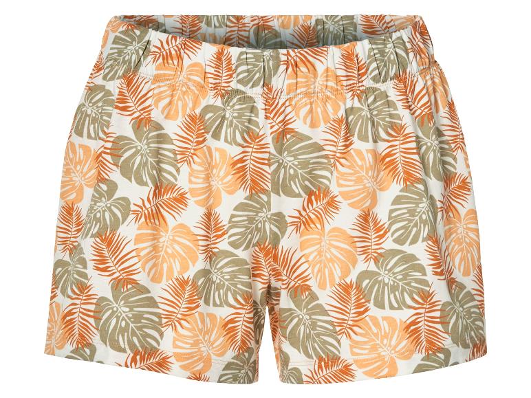 Kurze, gemusterte Shorts mit tropischem Blätterdesign.
