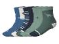 Set aus 6 Paar Kindersocken mit Dinosaurier-Motiven in Blau- und Grüntönen.