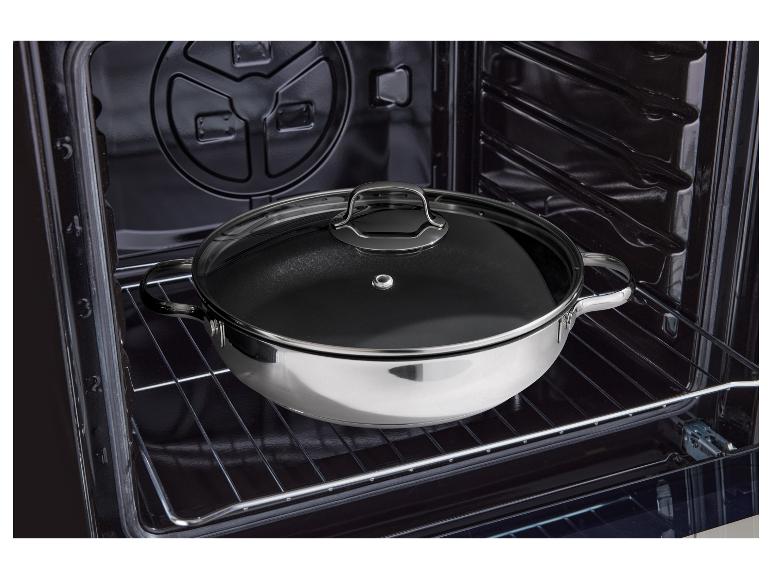 Ein Topf mit Glasdeckel, auf einem Ofenrost platziert.