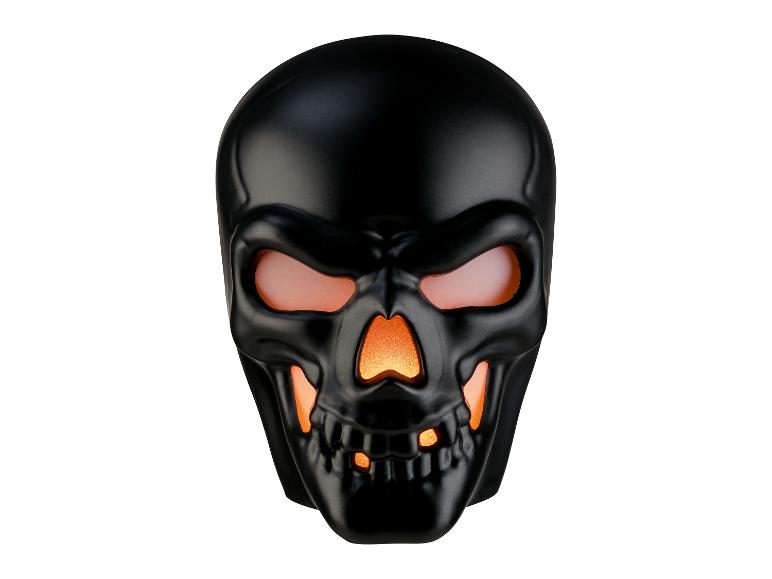 Schwarze Totenkopf-Halloween-Dekoration mit leuchtenden orangefarbenen Augen und Mund