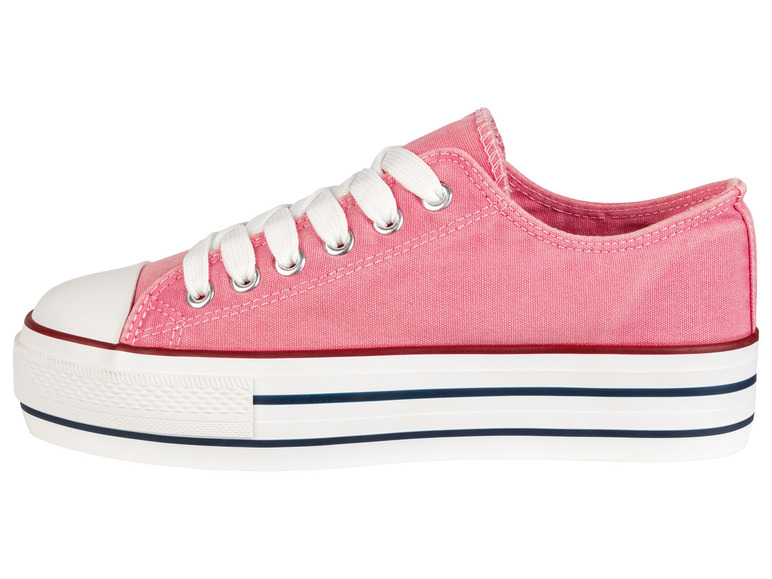 Ein rosa Canvas-Sneaker mit weißen Schnürsenkeln