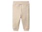 Beige Babyhose mit geripptem Bund und Bündchen.