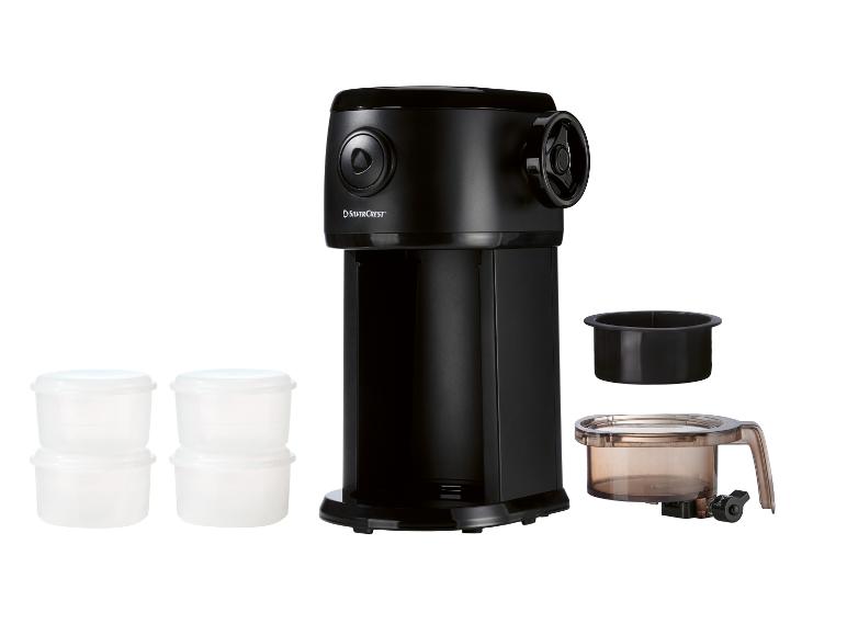 Schwarze Kaffeemühle mit Zubehör und Plastikbehältern.