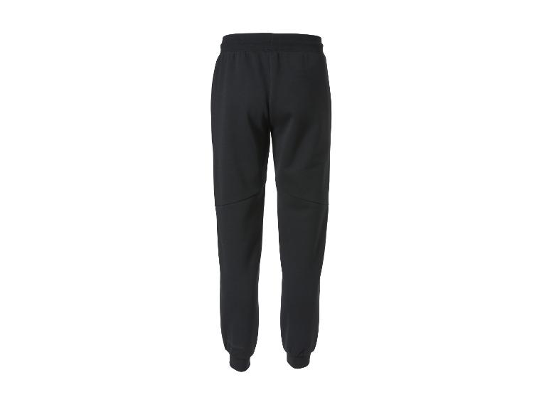 Schwarze Jogginghose mit elastischem Bund und Bündchen an den Knöcheln, Rückansicht.