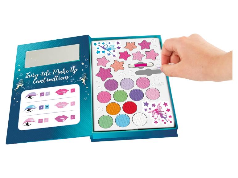 Ein Make-up-Set für Kinder mit Lidschatten, Lippenstift und Aufklebern im Feen-Design.