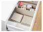 Beige Textil-Aufbewahrungsboxen für Schubladen, ideal für gefaltete Kleidung.