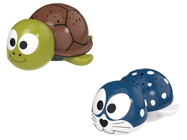 Zwei tierförmige Nachtlichter: eine grüne Schildkröte und eine blaue Robbe.