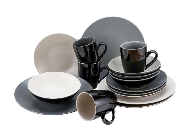 Schwarze Tassen und Teller in Grautönen und Beige.