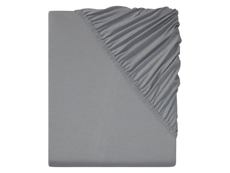 Graues Baumwoll-Spannbettlaken mit elastischen Ecken.