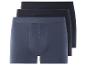 Drei Paar blaue Boxershorts.