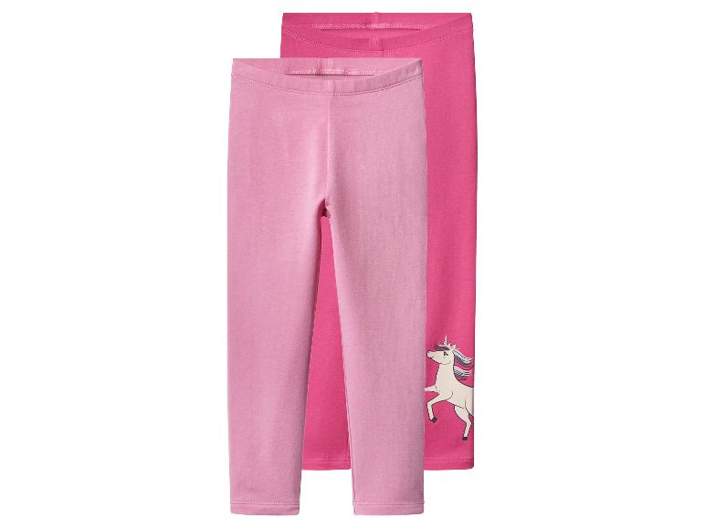 Zwei Paar rosa Leggings, eine mit Einhorn-Motiv.