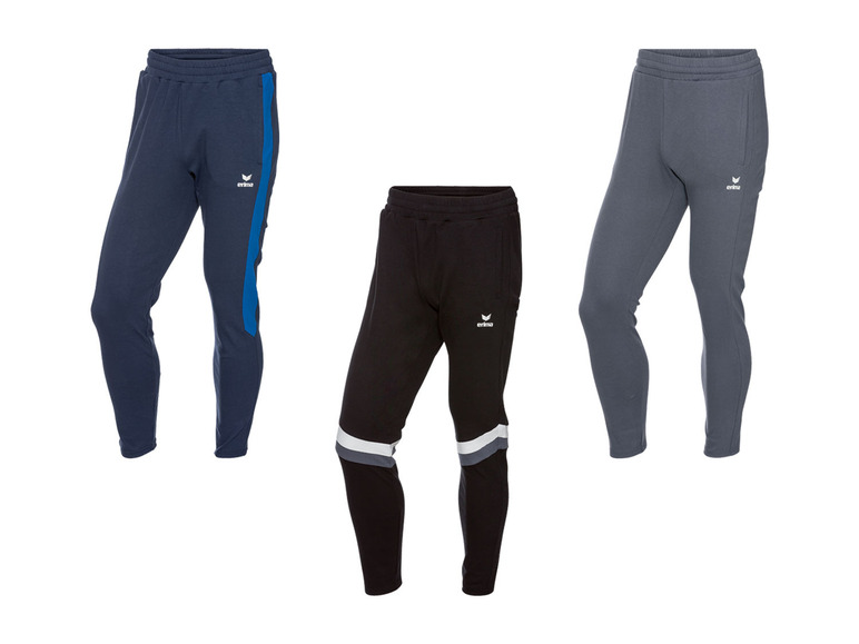 Drei verschiedene Errea Trainingshosen in dunkelblau, schwarz und grau.
