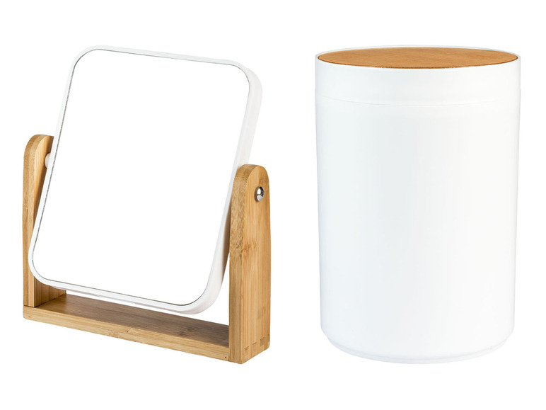 Ein weißer Spiegel mit Holzrahmen und ein weißer runder Topf mit Holzdeckel.