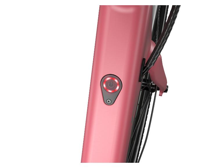 Nahaufnahme des Einschaltknopfs an einem rosafarbenen E-Bike.