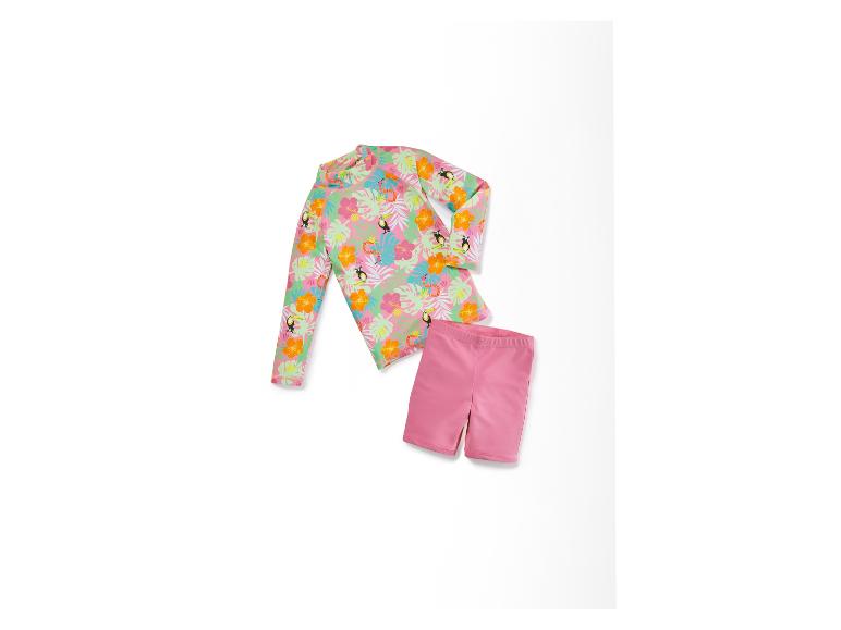 Kinder Badeanzug: Langarm-Shirt mit tropischem Muster und rosa Shorts.