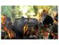GSW Dutch Oven aus Gusseisen auf einem Lagerfeuer mit Flammen und Glut.