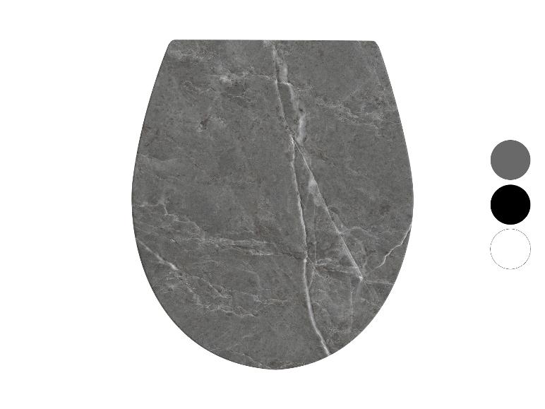 Grauer Toilettensitz in Marmoroptik mit einfarbigen Optionen.