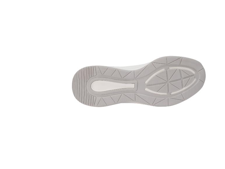 Graue und weiße Sportschuhsohle mit geometrischem Muster