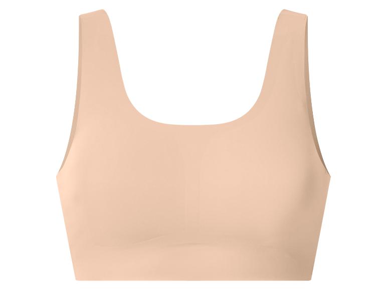 Nahtloser beiger Sport-BH für Damen.