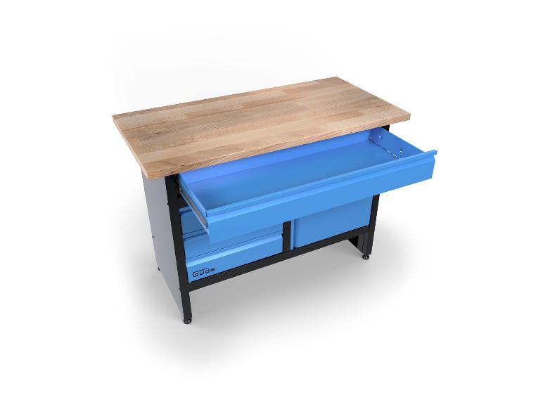 Werkbank mit heller Holzplatte und blauen Schubladen, eine davon offen.