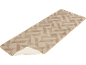 Beiger Läufer mit geometrischem Muster, teilweise aufgerollt, um die Rückseite zu zeigen.