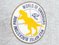 Ein rundes Logo mit einem T-Rex und dem Text 'World of Dinosaurs' und 'Blackstone Park'.