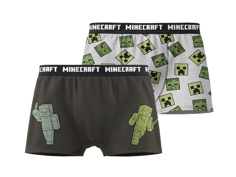 Zwei Kinder-Boxershorts im Videospiel-Design, eine mit Creeper-Köpfen, die andere mit Figuren.