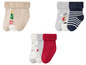 Weihnachts-Socken für Babys mit Rentier-, Weihnachtsbaum- und Punkte-Motiv.