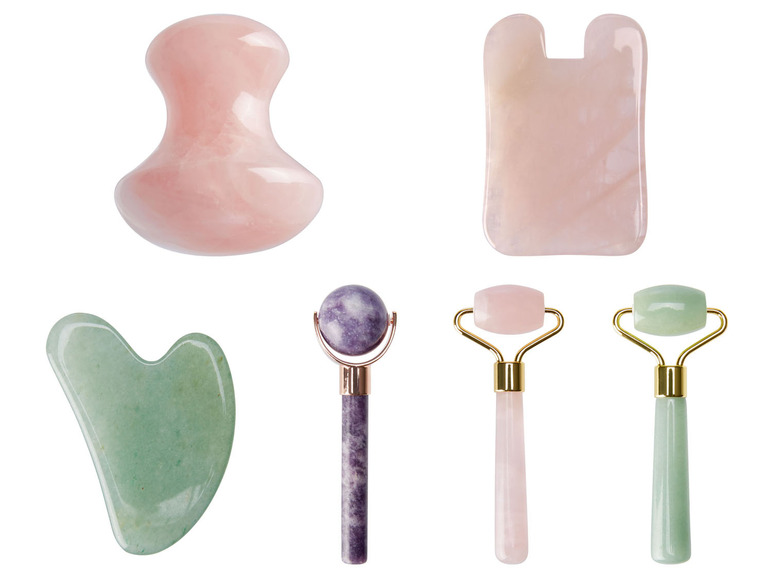 Gesichtsroller und -schaber aus Rosenquarz und Jade.