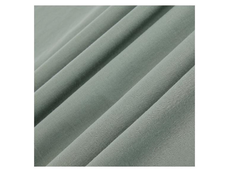 Nahaufnahme eines hellgrünen Stoffes.