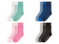 Drei Paar Socken von by s.Oliver in verschiedenen Farben und Mustern.