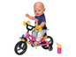 Baby Born Puppe mit Fahrrad, Trinkflasche und Zubehör.