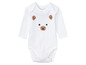 Weißer Baby-Body mit Bären-Motiv.