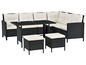 Schwarzes Rattan-Loungeset mit Tisch und Kissen.