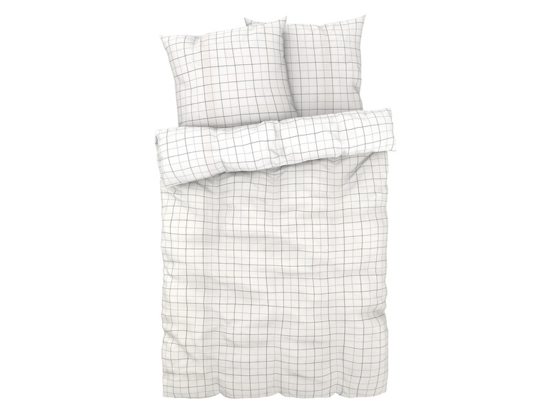 Ein weißes Bettwäsche-Set mit Karomuster.