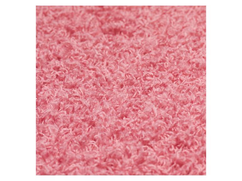 Nahaufnahme einer weichen, flauschigen rosa Stofftextur.