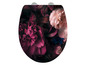Ein Toilettensitz mit einem Blumenmuster mit rosa und violetten Blumen