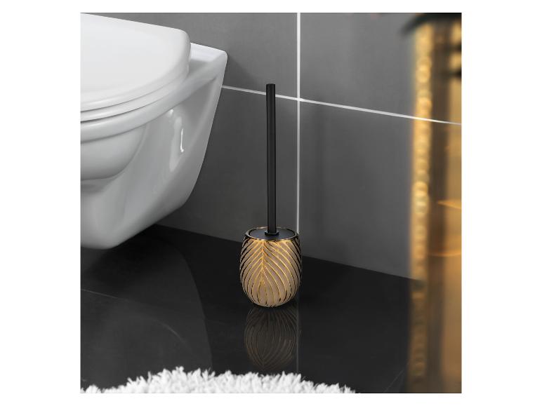 Goldene Toilettenbürste mit schwarzem Stiel.